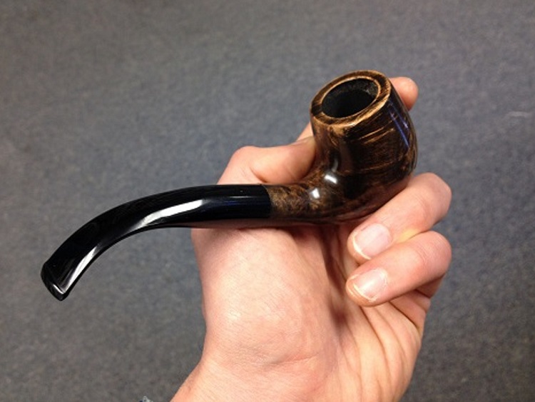 Briar wood tobacco pipe from Paykoc Pipes in hand of tobacco pipe smoker